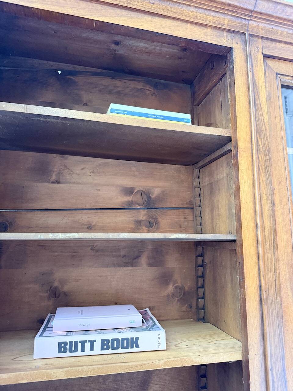 Glass-fronted walnut library 1900