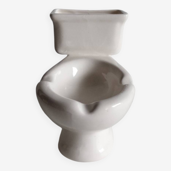 Atypical ashtray in the shape of a toilet