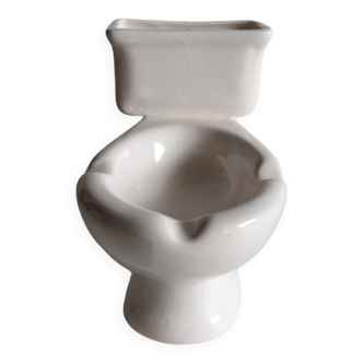 Atypical ashtray in the shape of a toilet