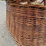 Old throne basket armchair in woven wicker