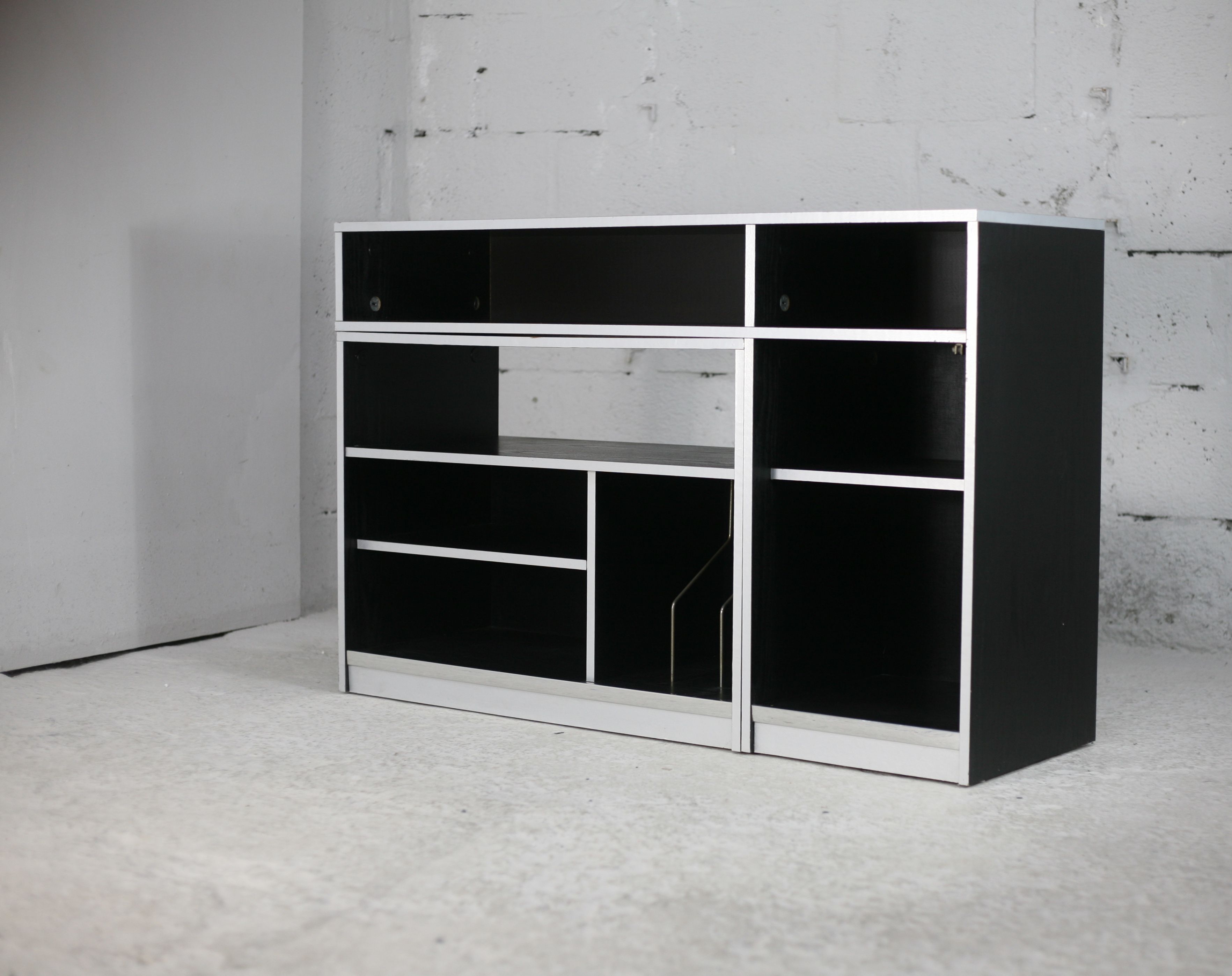 Storage cabinet wood compressed lacquered black lining margins aluminum. France, circa 1975.
