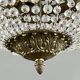 Empire-style chandelier in bronze with crystal pendants, early 20th century.