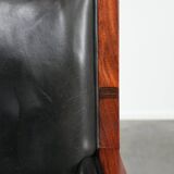 Black cowhide leather and wooden Art Deco design armchair