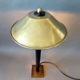 Post-Modern lamp in black metal and gilded brass.