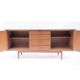 Vintage Scandinavian sideboard with an overflowing top.