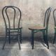 Two pairs of black 50s chairs - number 18 - cannée