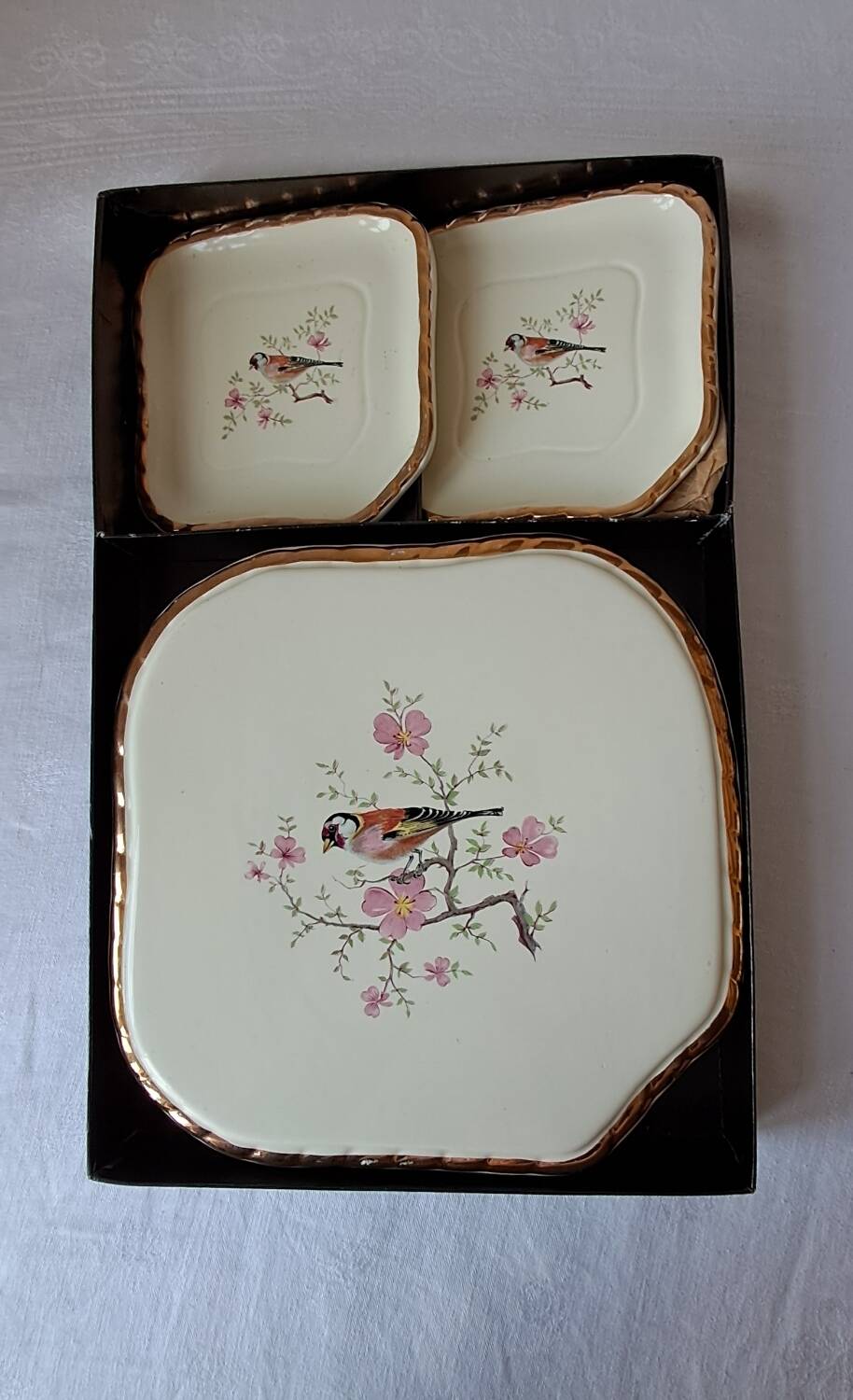 Trivet and bottle holder Salin, 1950s. Bird on branch.