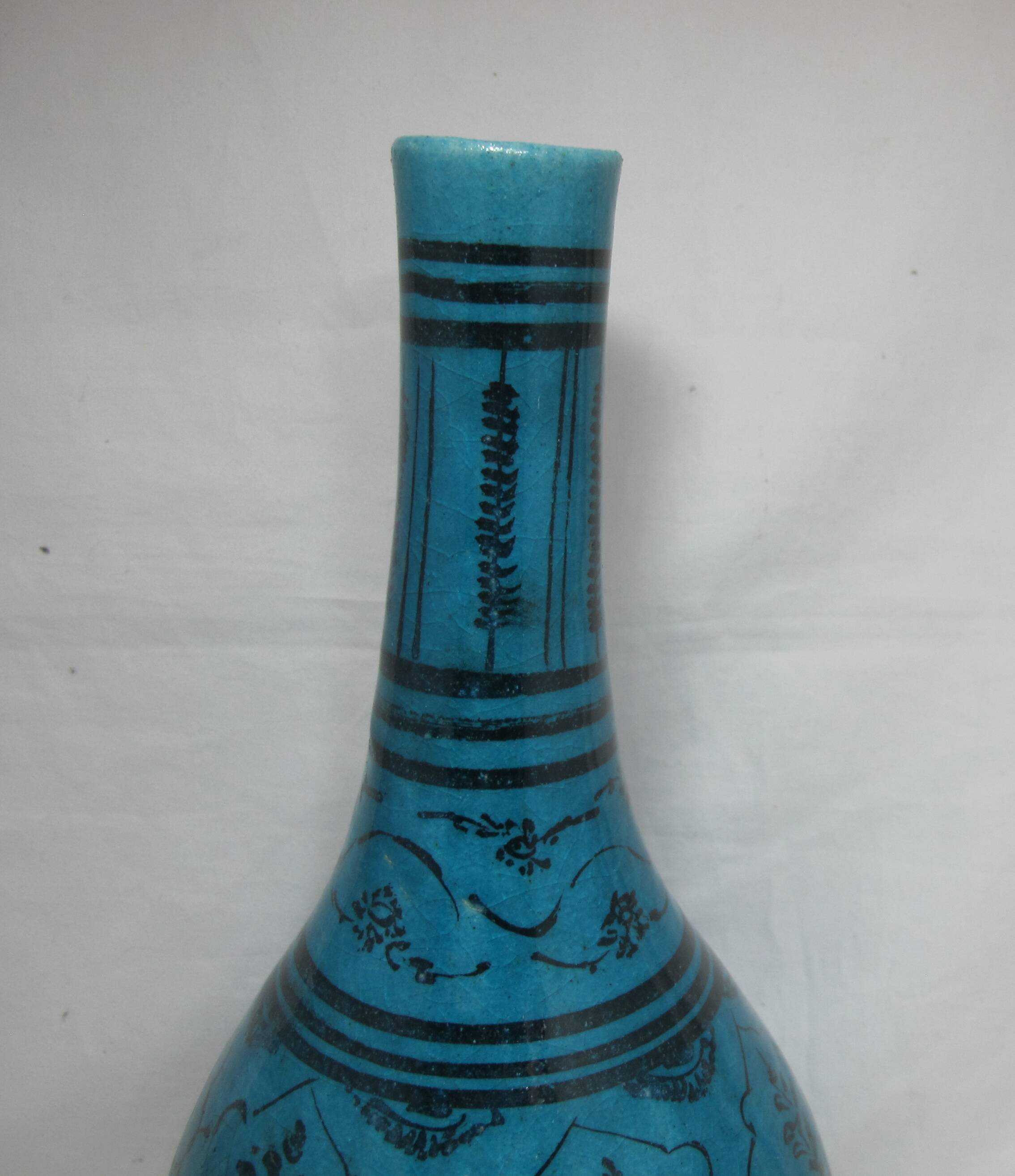 Islamic ceramic vase with turquoise background