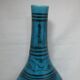Islamic ceramic vase with turquoise background