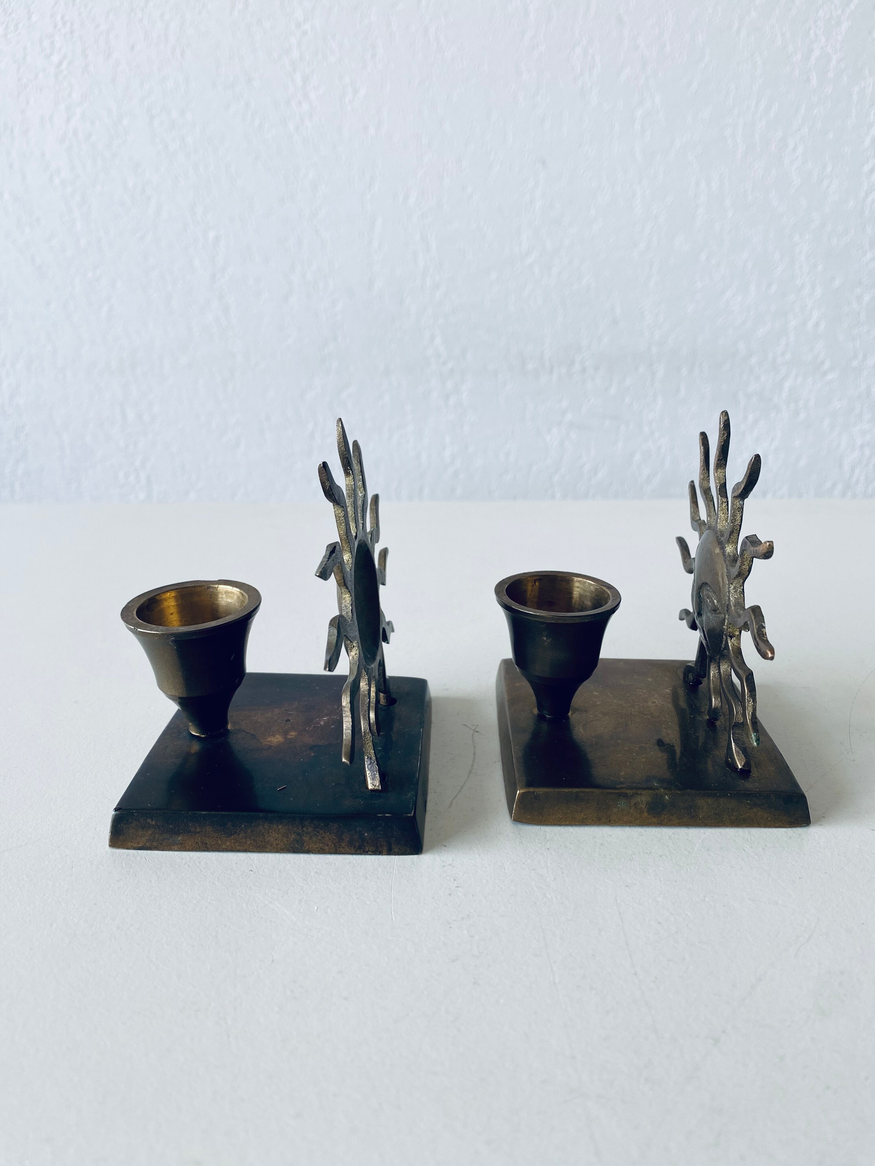 Pair of sun candle holders