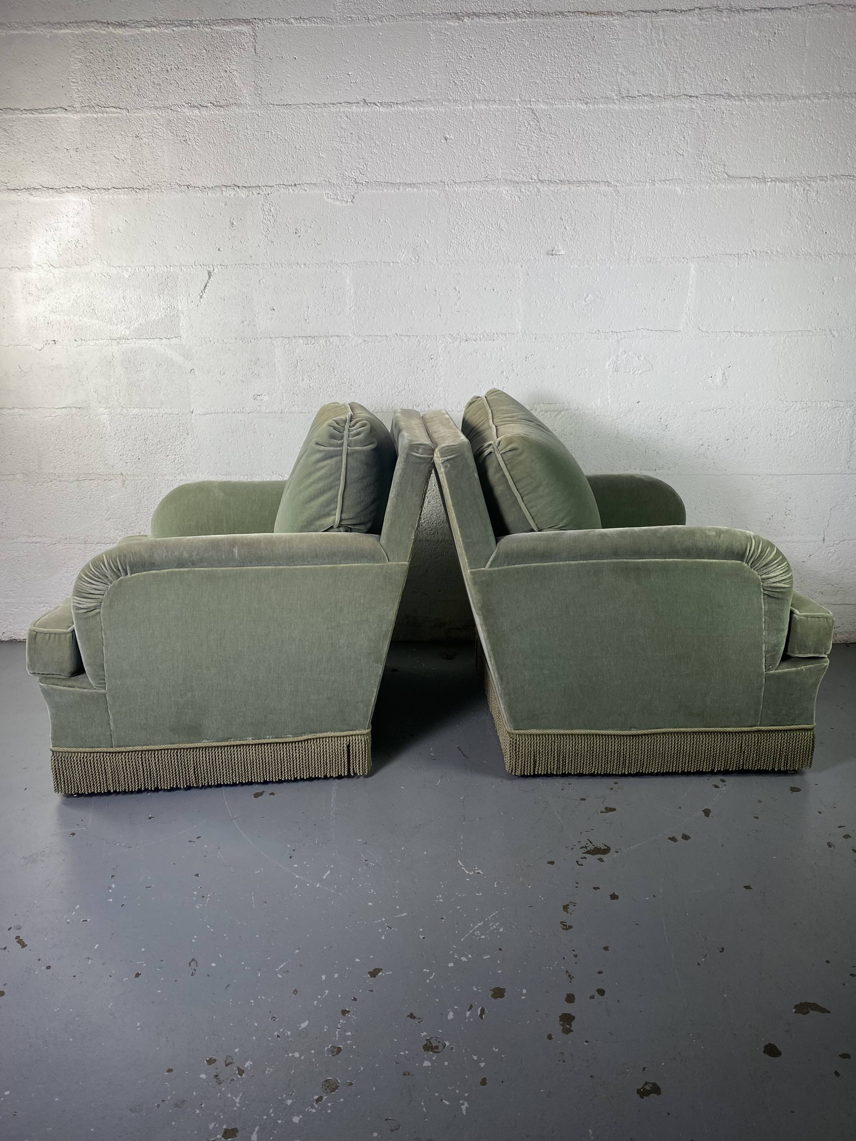 Pair of green velvet club armchairs