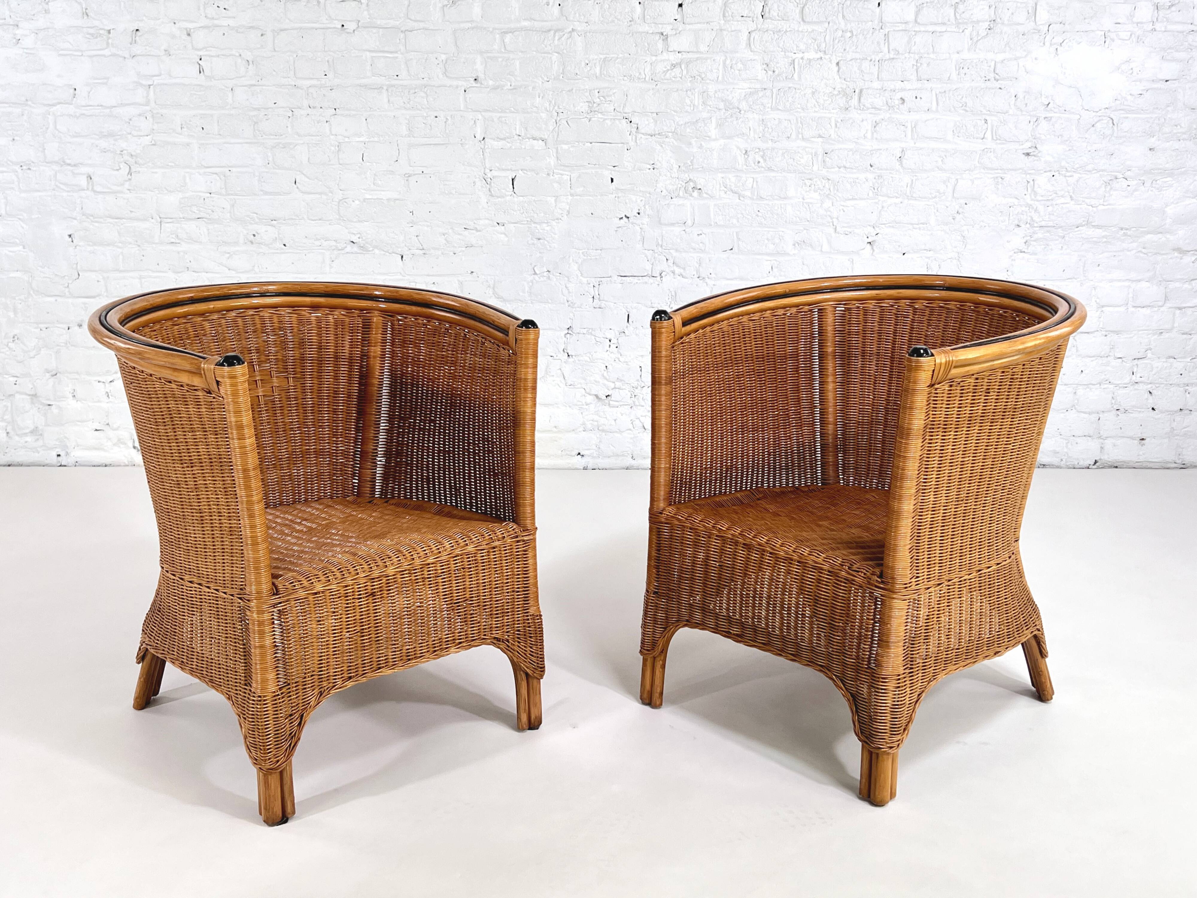 Pair of cabriolet armchairs in wicker and black edging
