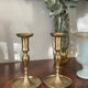 Pair of brushed brass candle holders