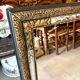 Rectangular Napoleon III mirror in moulded black and gold wood with engraved mirror decoration.