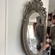 Miroir ovale biseaute  en bois et stuc
