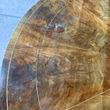 Antique round table with floral details.