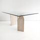 Dining table in travertine and glass with sculpted legs, 1970s.