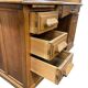 Vintage American desk made of solid wood with a curtain.