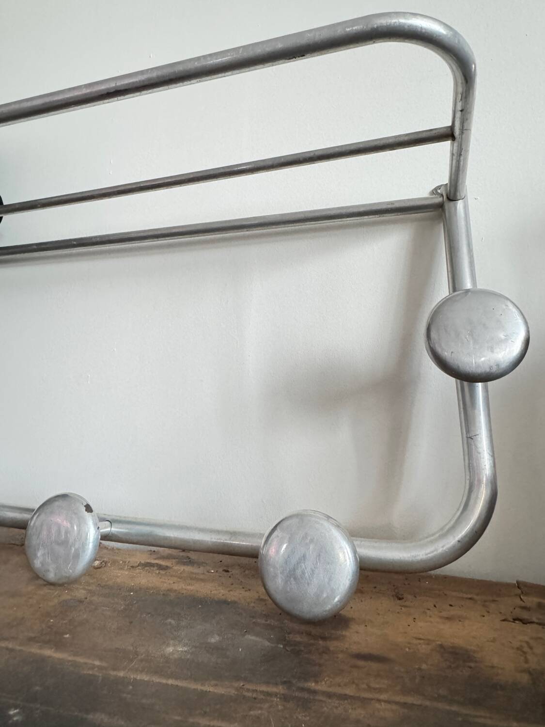 Vintage wall-mounted aluminum coat rack