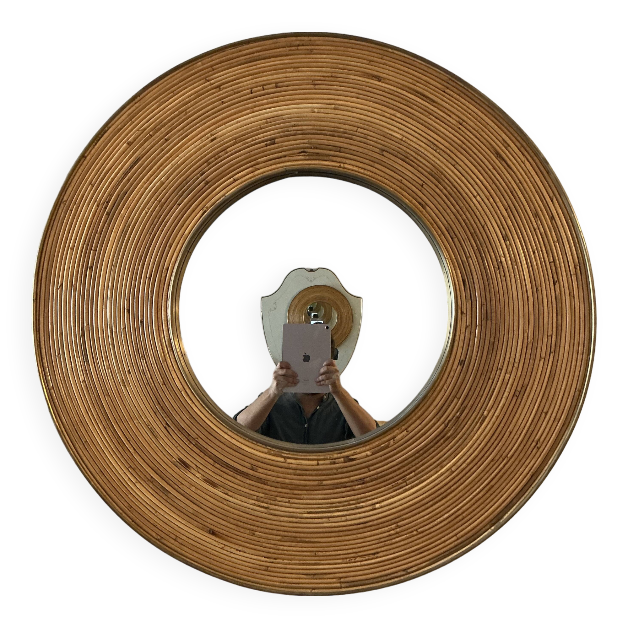 Large round mirror in rattan and brass