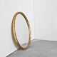 Oval mirror with gilded wood from the 1960s.