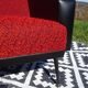 Vintage armchairs in red and black faux leather, the pair.
