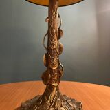 Brass foot table lamp with Tiffany style decor