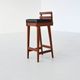 Erik Buck set of three bar stools in teak and leather Dyrlund Denmark 1960