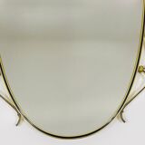 Elegant wall mirror in brass and black from the mid-century, Italy, 1950s.