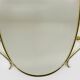 Elegant wall mirror in brass and black from the mid-century, Italy, 1950s.