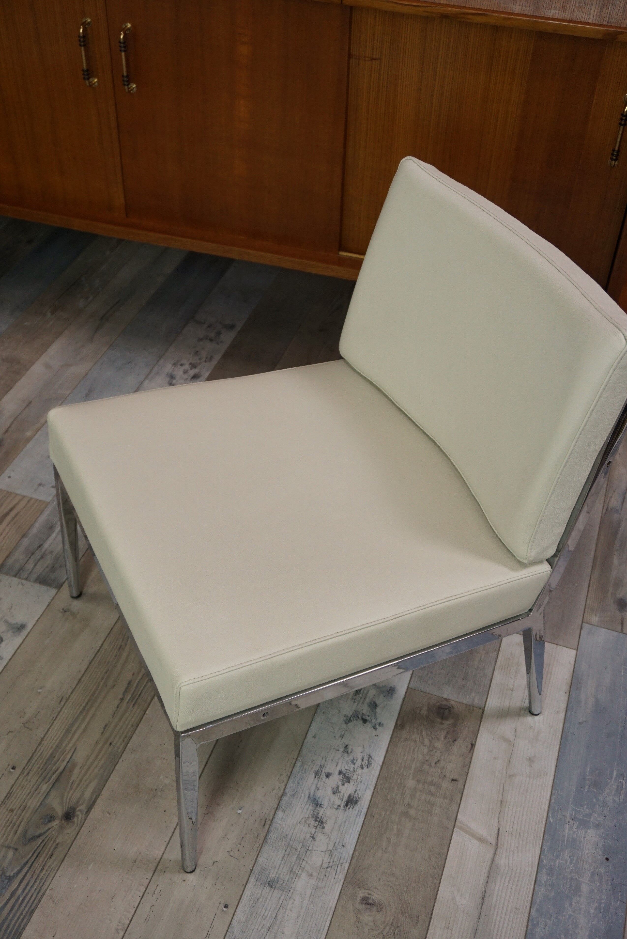 Pair of chrome and leather armchairs