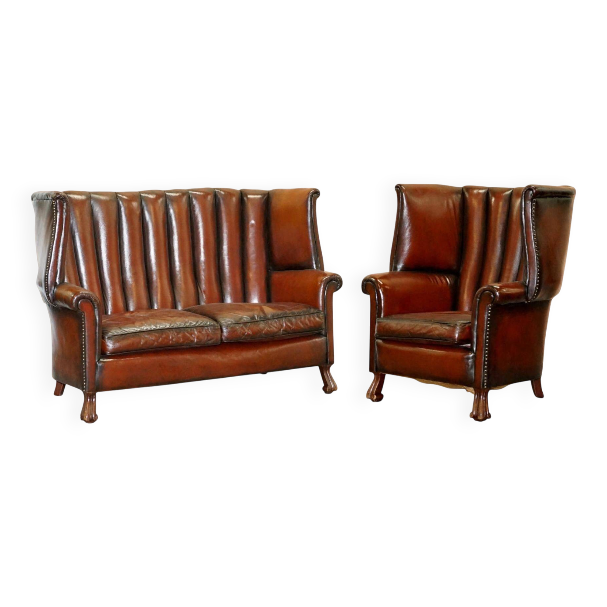 Victorian leather canapé and armchair, barrel back, circa 1860, restored.