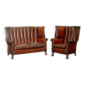 Victorian leather canapé and armchair, barrel back, circa 1860, restored.