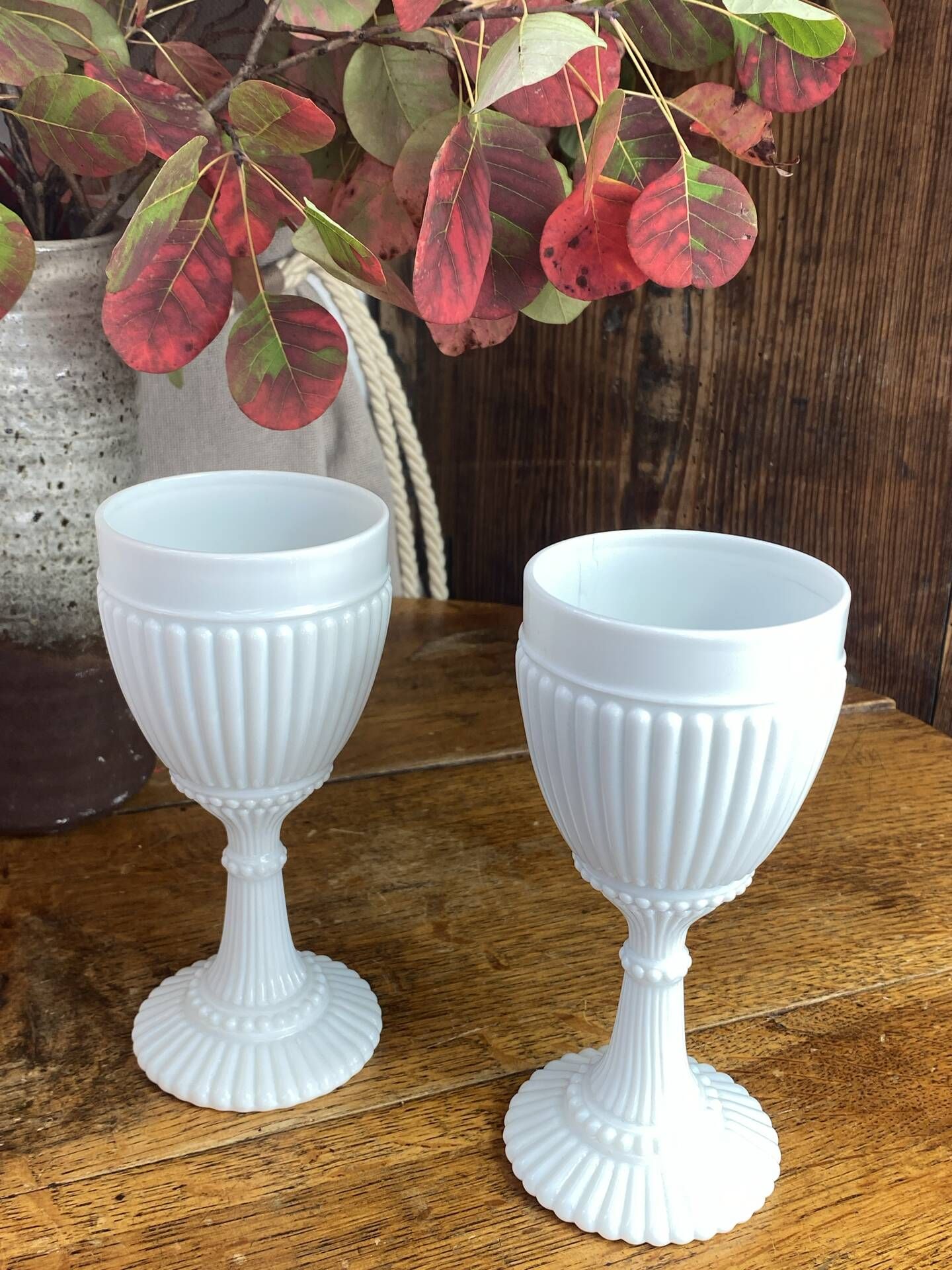 Footed glasses, white opaline chalices