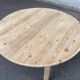 Scandinavian round extendable dining table stripped in solid wood from the 1970s.