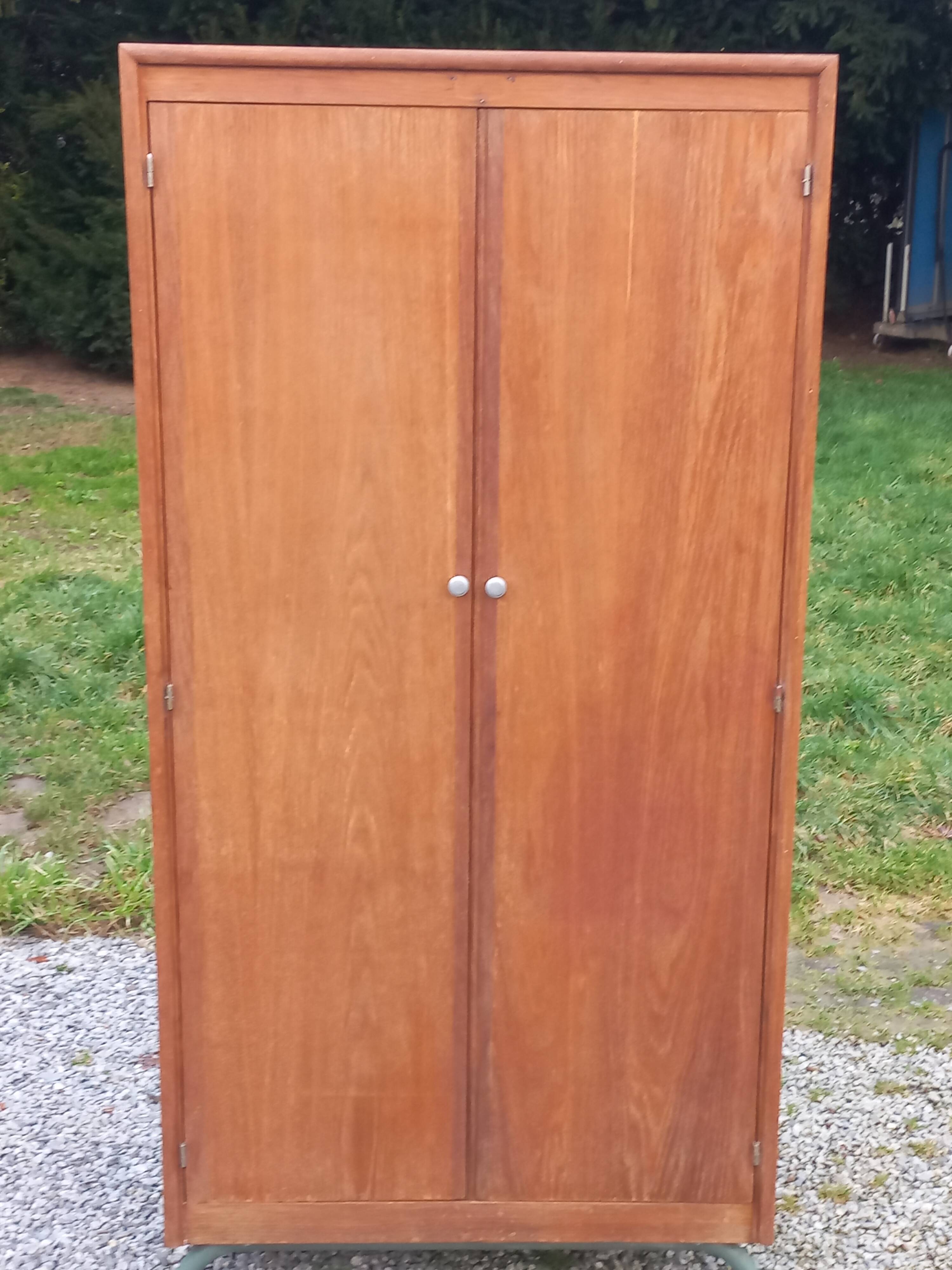 Vintage oak wardrobe with metal legs from the 1950s.