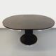 Vintage dining table in melamine with a black wood effect and chrome metal.