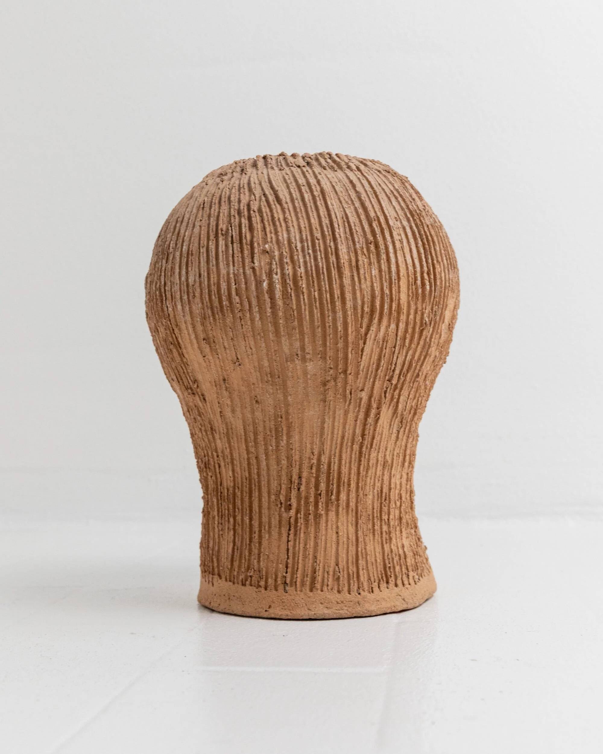 Vintage ceramic vase from the 1980s, sculptural head shape with a green glazed face, terracotta art object.