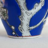 Old blue vase with vintage porcelain cherry blossoms