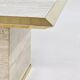 Square coffee table from the 70s in travertine and brass.