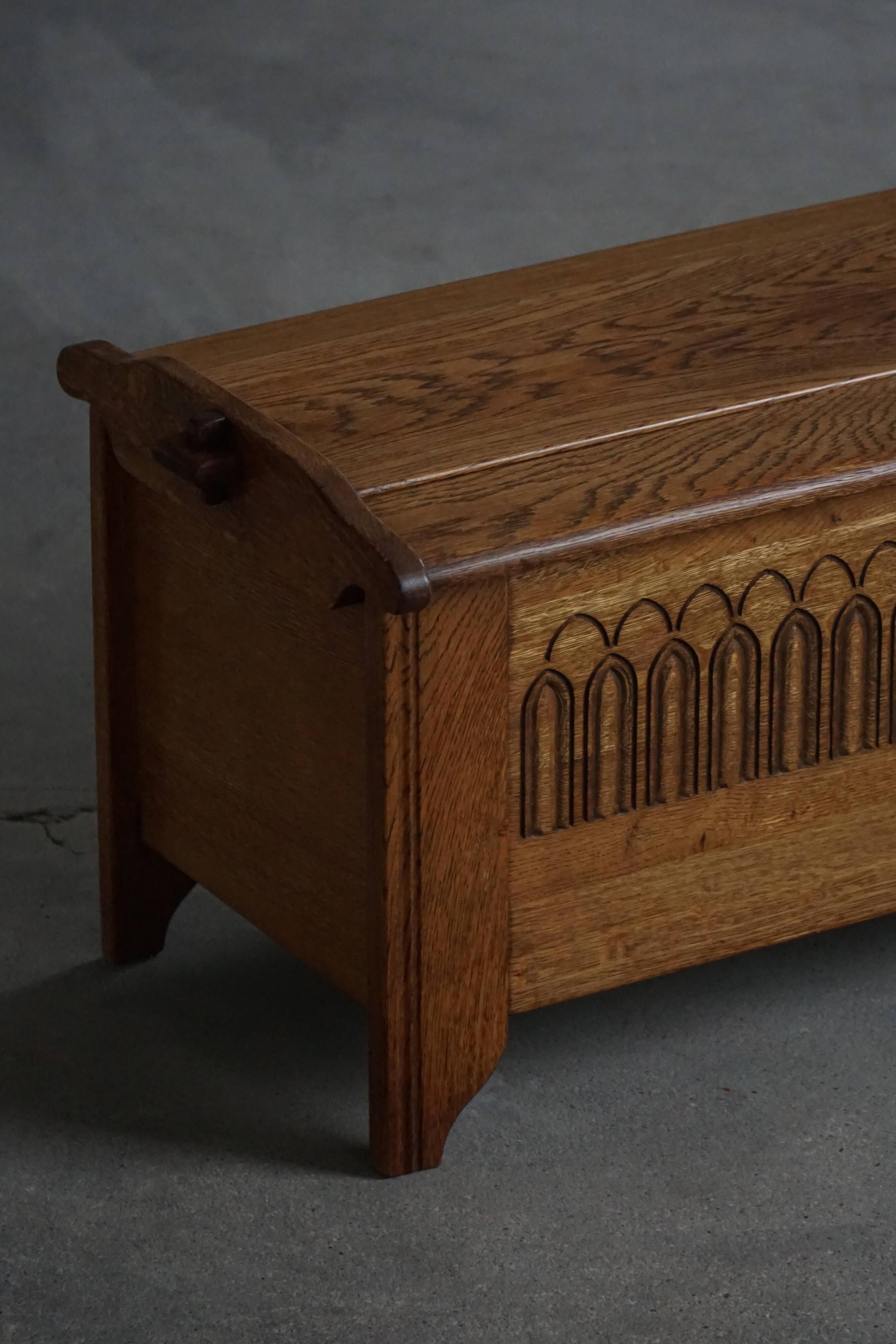 Modern Danish oak commode with decorative relief sculpture, mid-20th century.