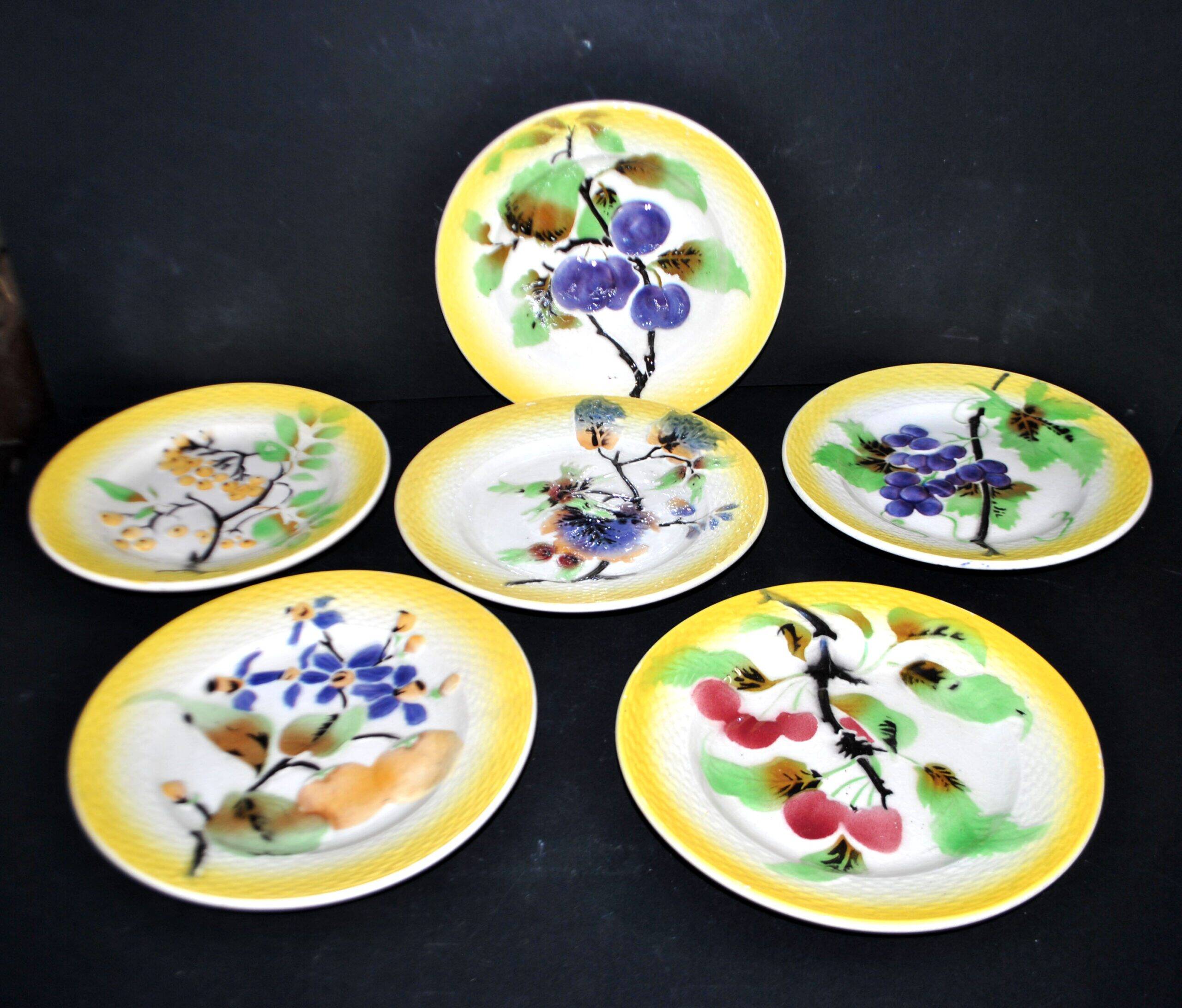 Orchies set of 6 yellow earthenware dessert plates with stencilled fruit decoration.