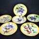 Orchies set of 6 yellow earthenware dessert plates with stencilled fruit decoration.