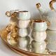 Fruit-shaped liqueur service in porcelain or tea set with its mirror tray.