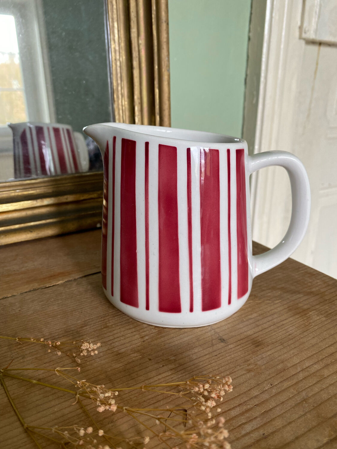 Old striped milk jug