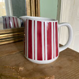 Old striped milk jug