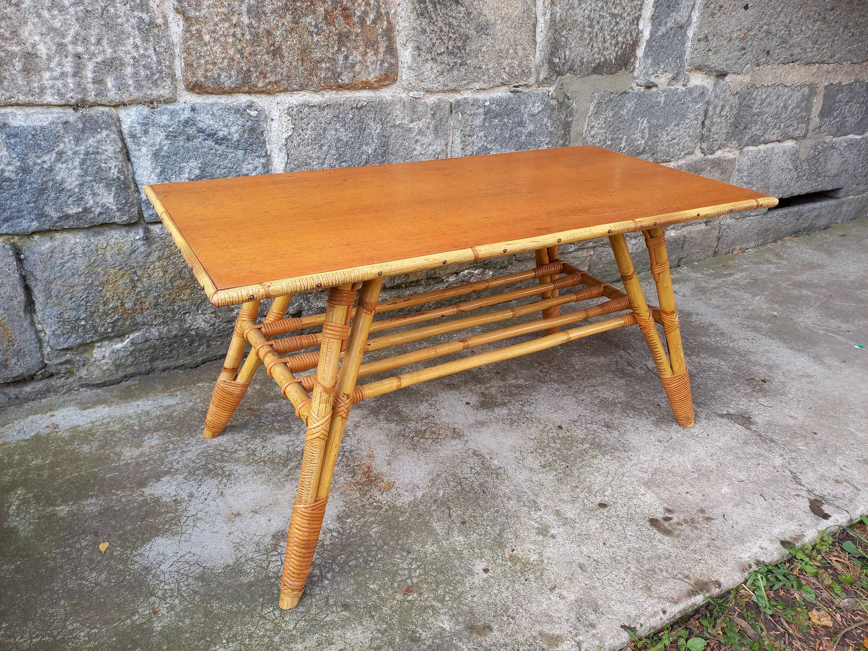 Rattan coffee table with compass legs