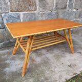 Rattan coffee table with compass legs
