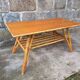 Rattan coffee table with compass legs