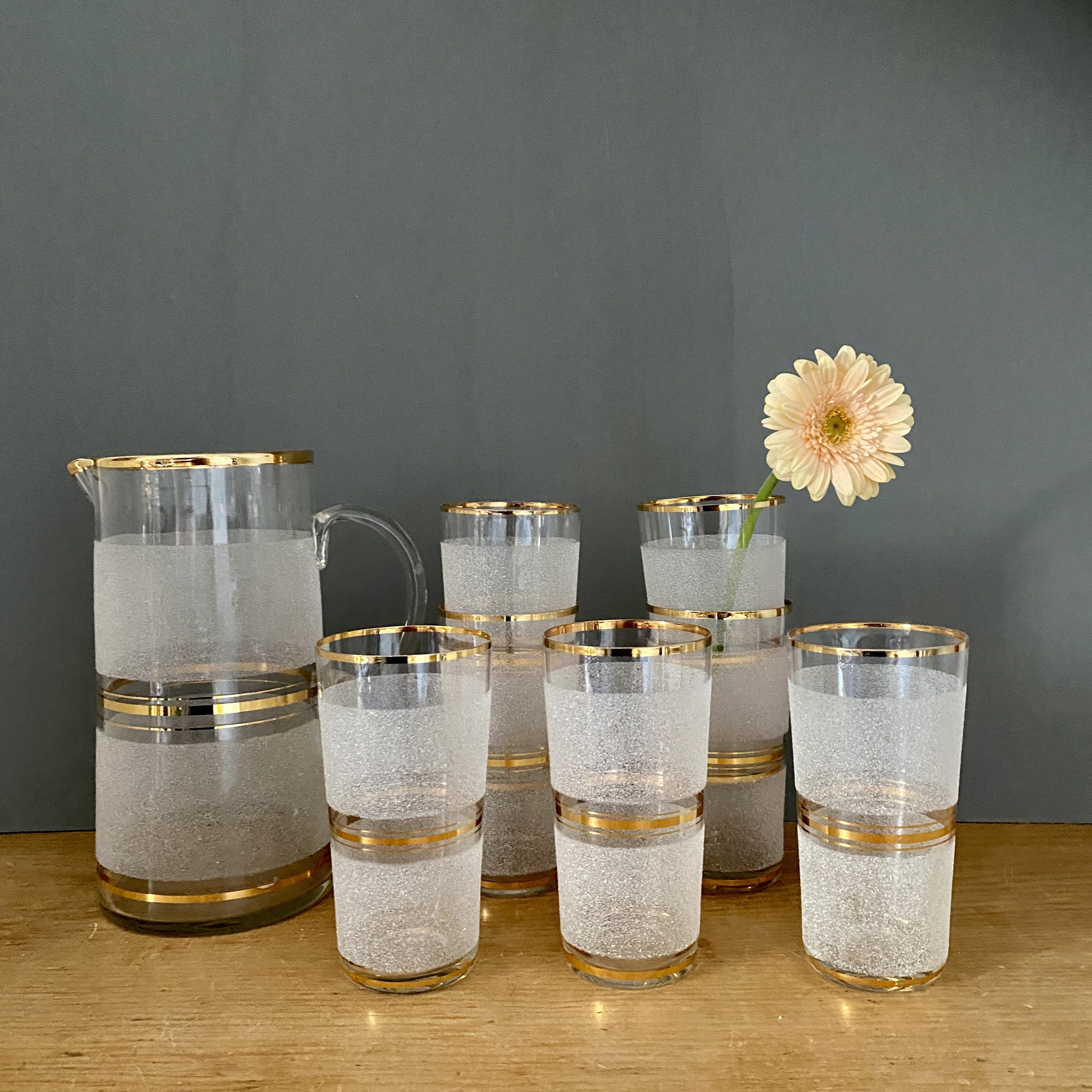 Vintage orangeade service in white granite glass and golden edging